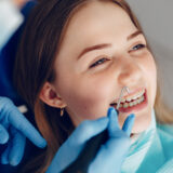 Dentist at Meadowvale Dental Centre helping a patient achieve a lasting smile